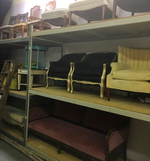 event rental storage warehouse with shelves and furniture