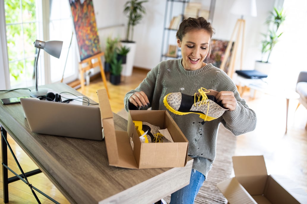 Woman unboxing her order post-purchase