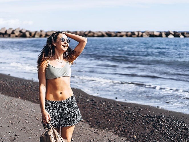 Fit woman with slim waist you can get with CoolSculpting