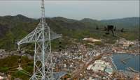 日本一高い送電鉄塔にかかる海峡横断部の送電線点検