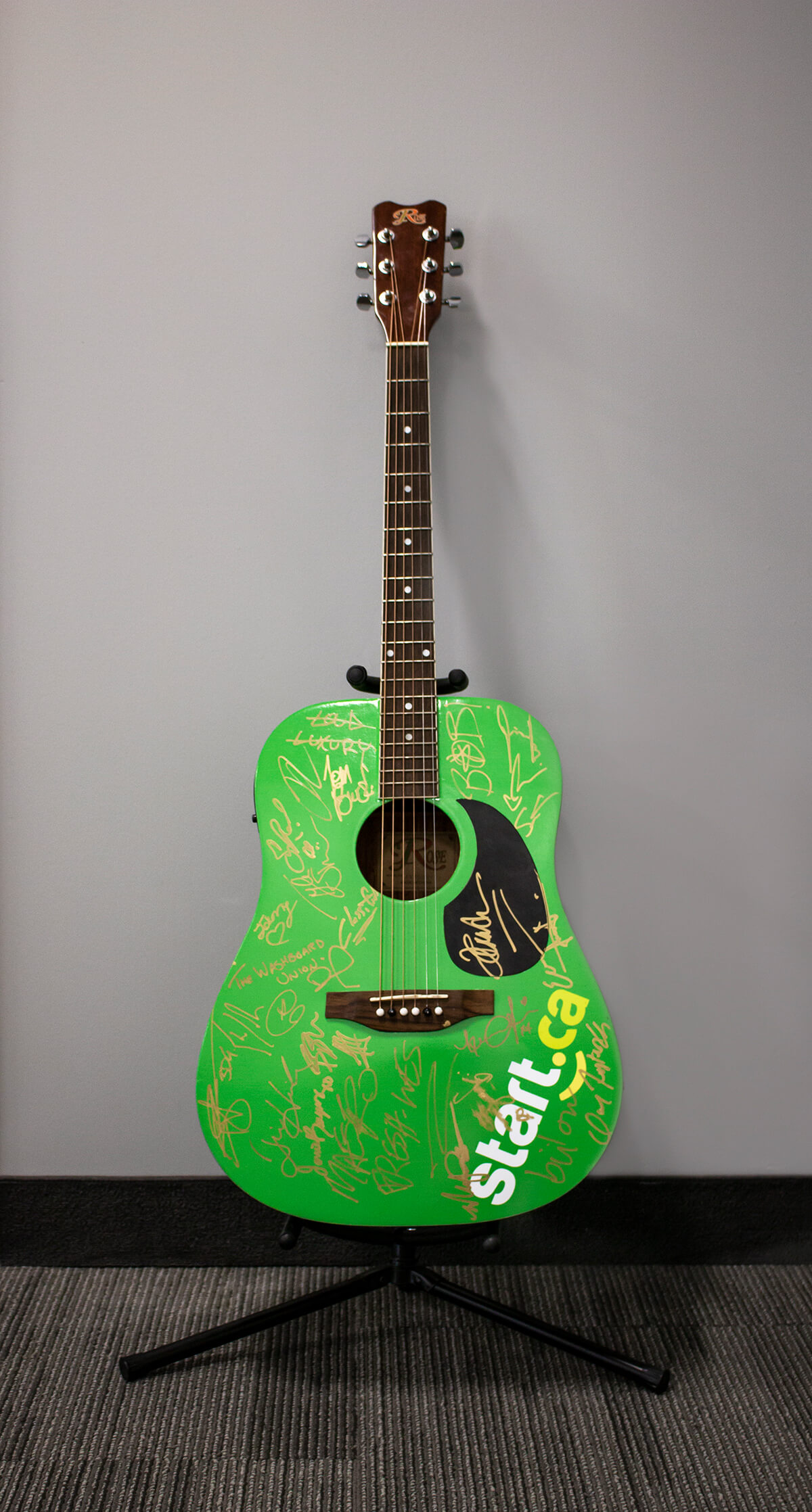 Fully autographed 2019 JUNOS Start.ca green guitar