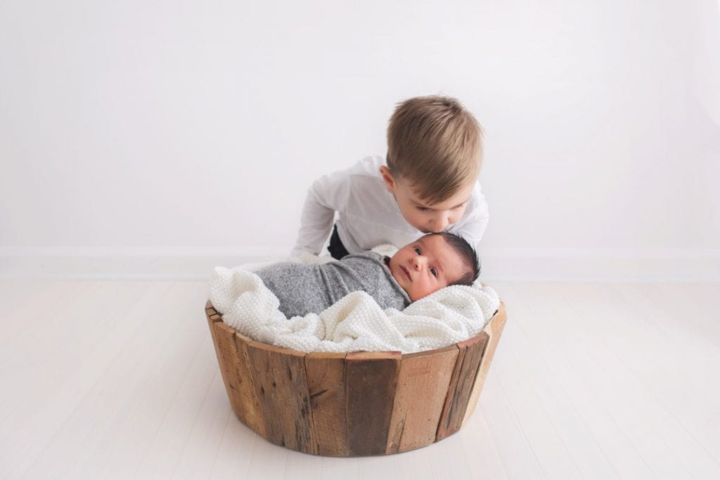 sibling photos with a newborn baby