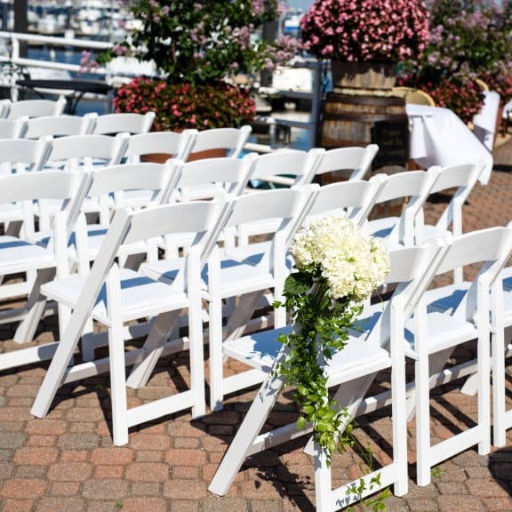 Beautiful chiavari chairs at an outdoor wedding