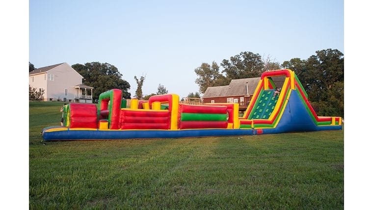 Large outdoor inflatable obstacle course at fun outdoor event