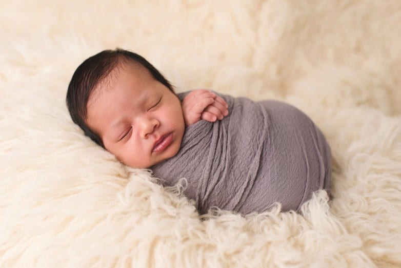 newborn baby photo swaddled in flokati