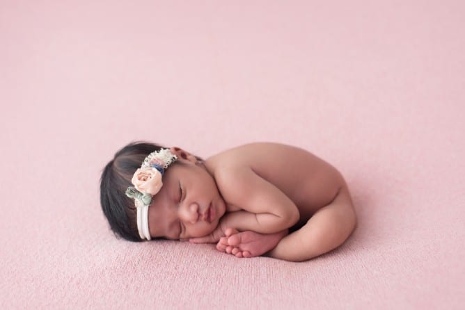newborn baby photo in taco pose