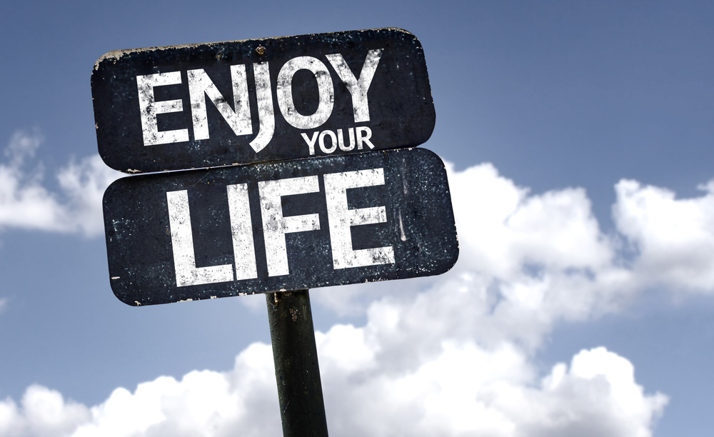 Enjoy your Life sign with clouds and sky background-crop