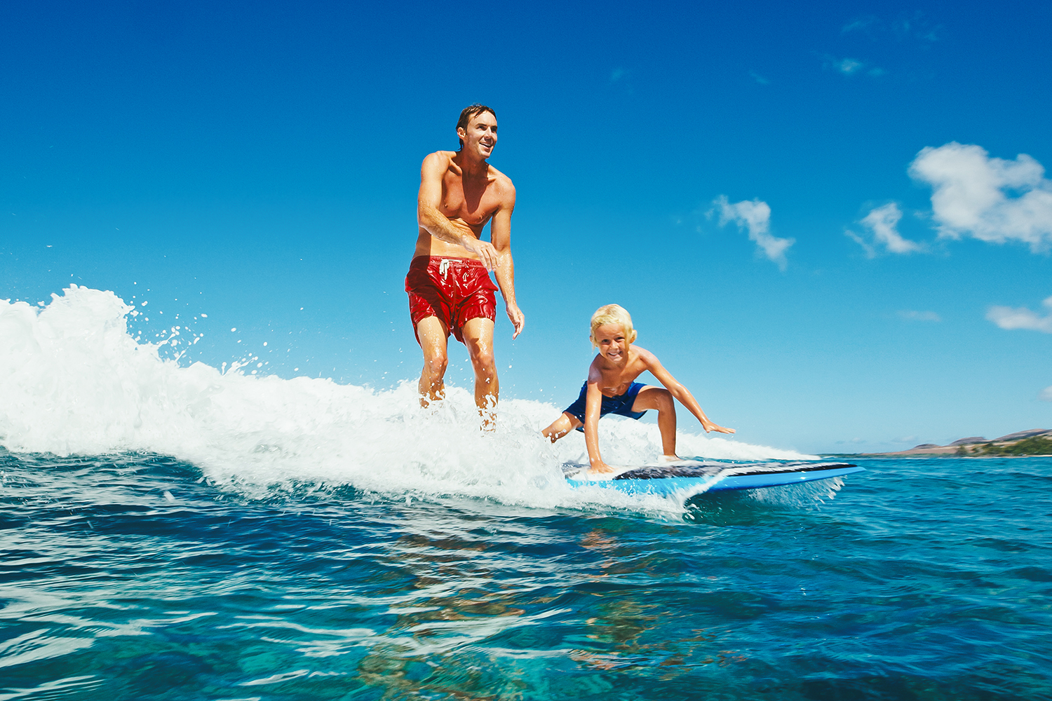 hawaii surf father son shutterstock_467420006 1500x1000