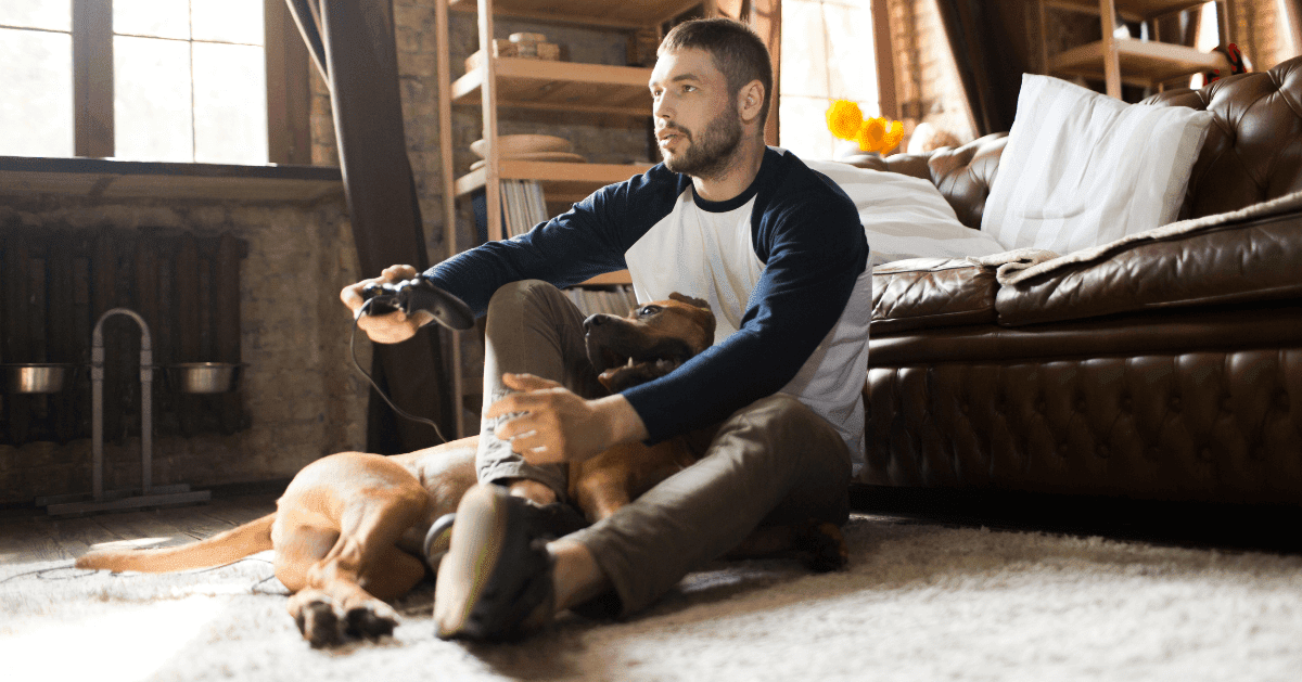 dog lying on rug with owner