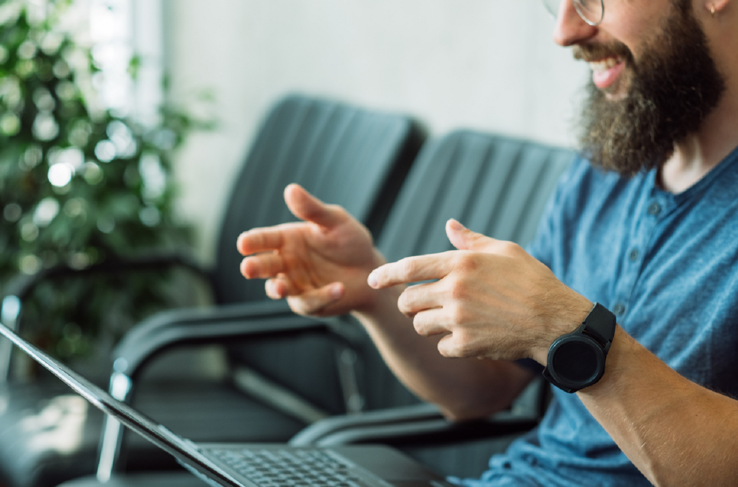 Man using laptop to conduct a video job interview