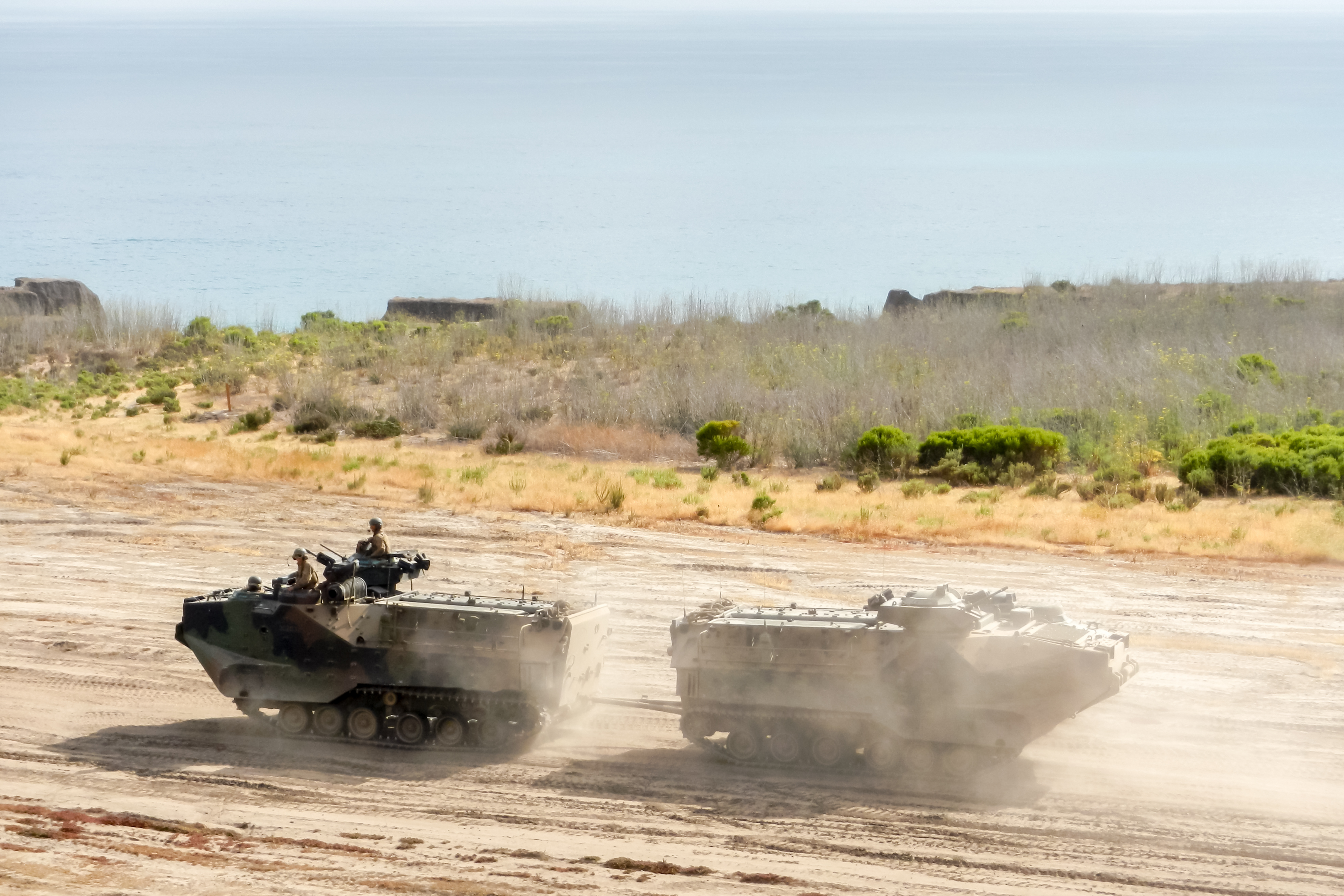 Military Vehicles in the desert, representing contract jobs in the Middle East