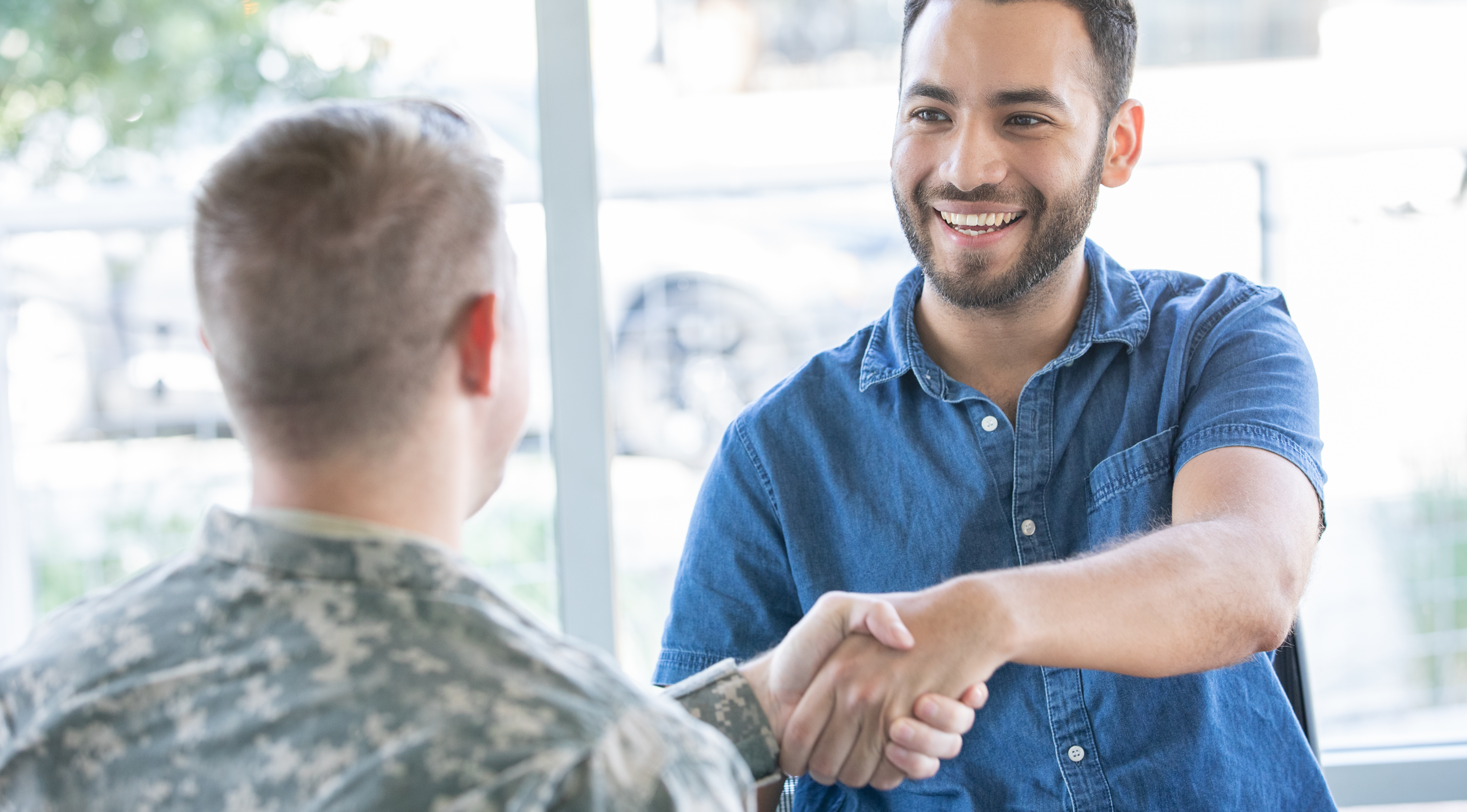 Two men in an interview to represent job hunting support M&E can provide