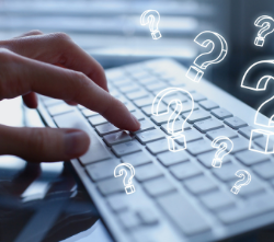 hands typing on a computer