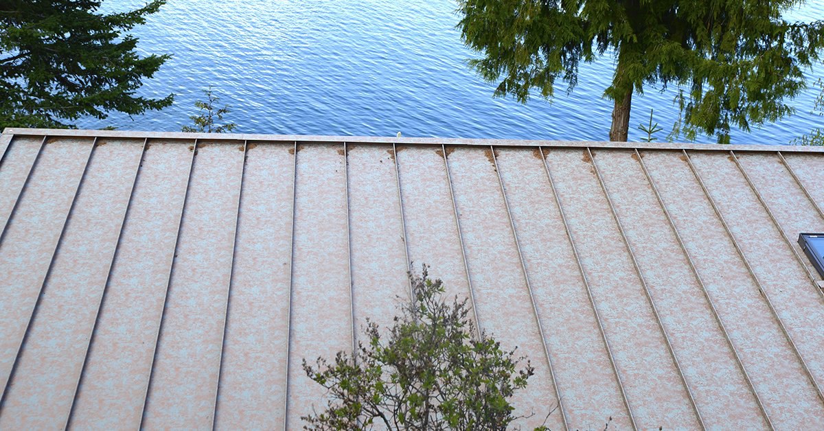 https://f.hubspotusercontent30.net/hubfs/6069238/images/email/aged-copper-standing-seam-roof-lake-house.jpg