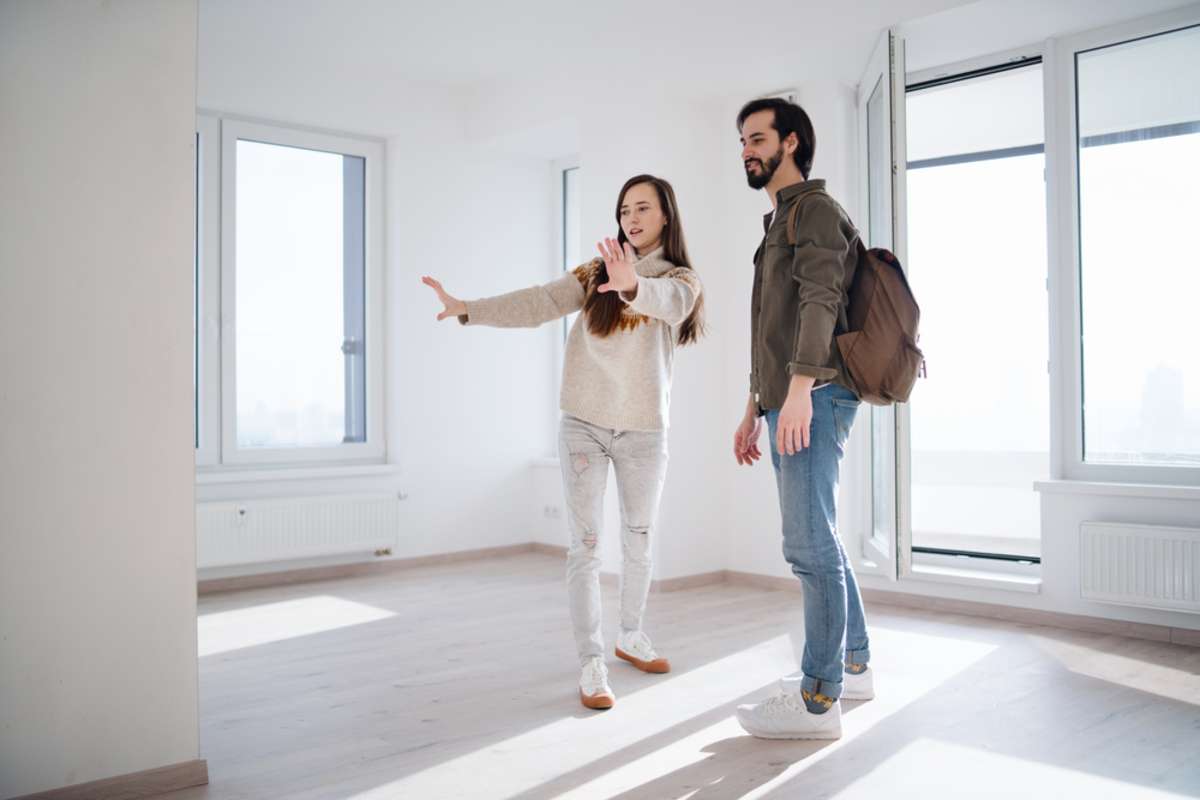 Young couple moving and planning in new flat