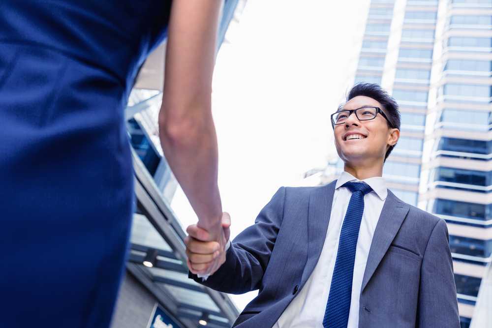 Businessman meeting his colleague outdoors